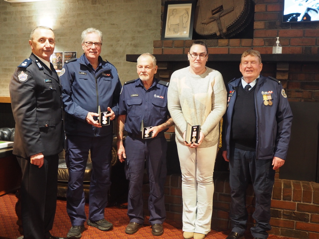 Tarwin Lower & District members Jim Barr, Rod Hill and Mel Meade, are congratulated by District 9 Commander Andrew McCartney (left) and Captain Mick Moore (far right).